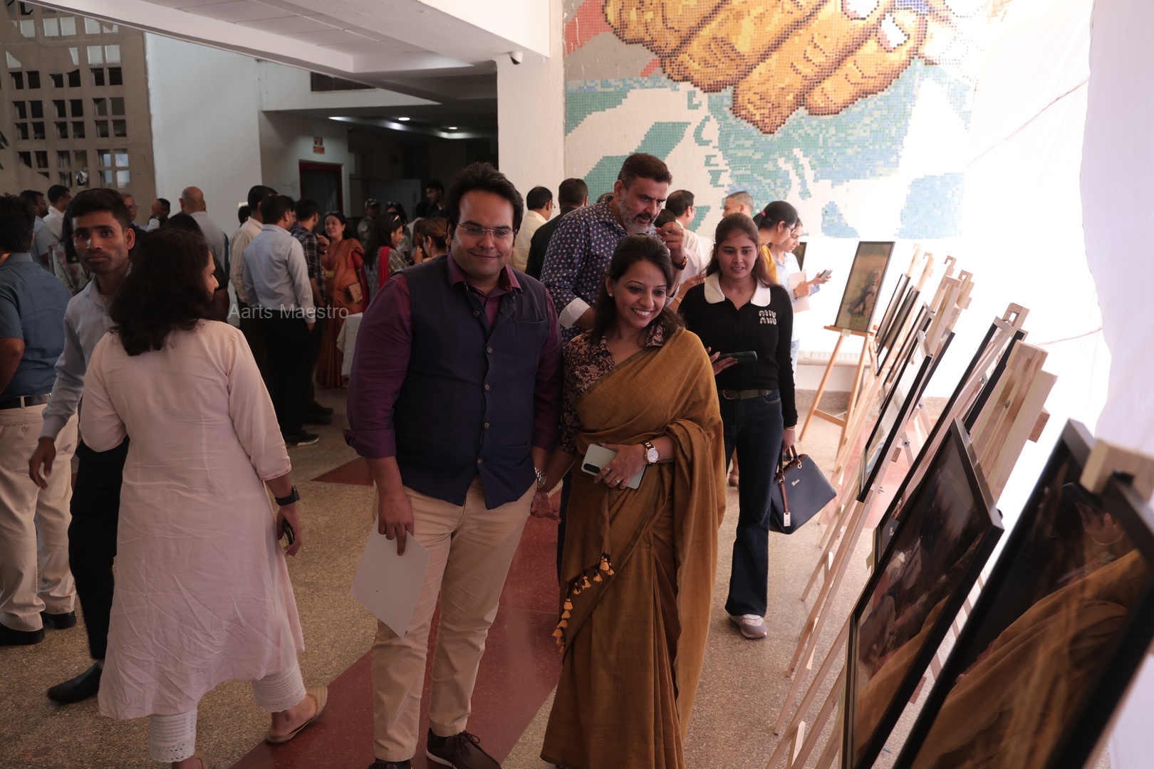 4th Prize Winner Anosh Koppikar with his family viewing his award-winning photographs at the exhibition