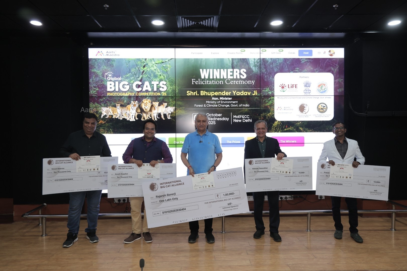 Top Prize Winners proudly displaying their cash prize cheques and Winner Certificate at the ceremony